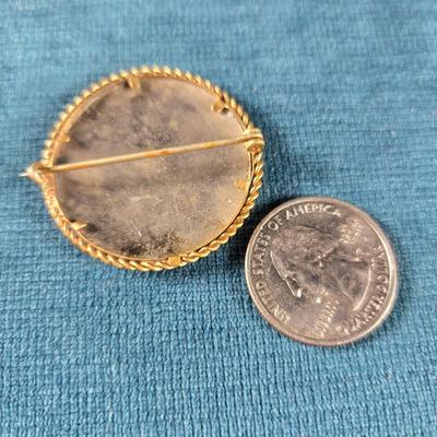 Sale Photo Thumbnail #179: This auction lot is for a Victorian Mourning Broach - #1. This is a very special Victorian Mourning Broach of a baby.  It is nicely framed in a brass broach case with a glass cover that is about  1-3/8-inches in diameter.  It is in very good condition for