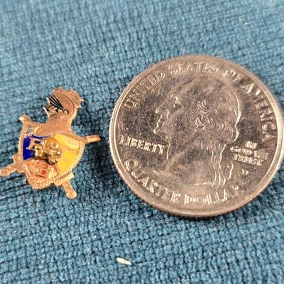 Sale Photo Thumbnail #205: This auction lot is for a Knights of Pythias Circa 1880 Pin. This is a very small Knights of Pythias Pin from 1880.  It is Gold and Enamel.  It is missing the pin arm in the back.  The Knights of Pythias is a fraternal organization and secret society foun