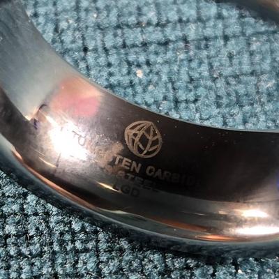 Sale Photo Thumbnail #208: This auction lot is for a Man's Tungsten Carbide Wedding Ring. This man's wedding ring is made of Tungsten Carbide Steel and embedded with 11 lab-grown diamonds.  It is not only very handsome - it is virtually indestructible.  These rings are designed for