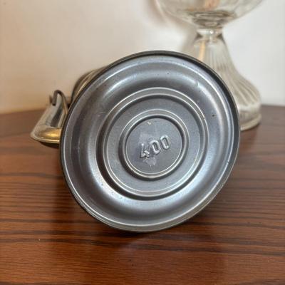 LOT 89: Cast Iron "Give Me a Penny" Bank, Vintage Hurricane/Oil Lamp, Indoor/Outdoor Thermometer & More