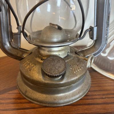 LOT 89: Cast Iron "Give Me a Penny" Bank, Vintage Hurricane/Oil Lamp, Indoor/Outdoor Thermometer & More