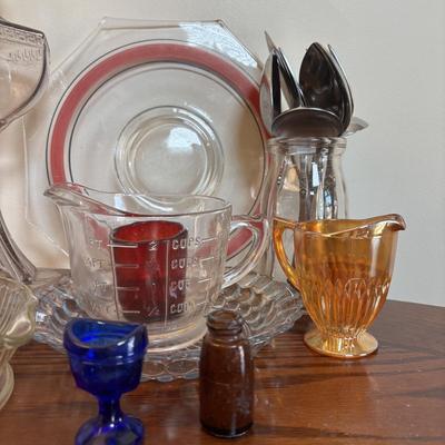 LOT 91: Vintage Hazel-Atlas Juicer, Spry Measuring Glass, Abbots Milk Bottle, Cobalt Blue Eye Cup, Carnival Glass Creamer, Hurricane Lamp...