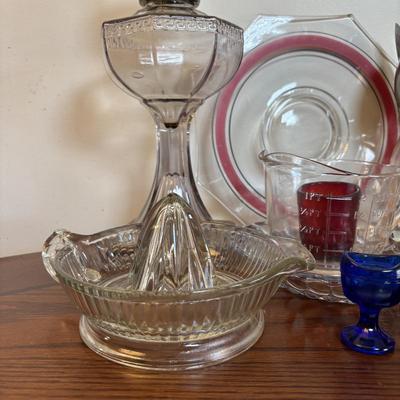 LOT 91: Vintage Hazel-Atlas Juicer, Spry Measuring Glass, Abbots Milk Bottle, Cobalt Blue Eye Cup, Carnival Glass Creamer, Hurricane Lamp...