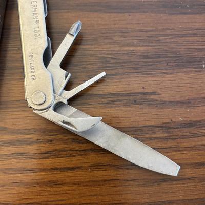 LOT 94: Pocket Knives: Brown Stone 715, Leatherman Tool, Combo Edge