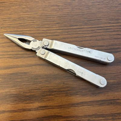 LOT 94: Pocket Knives: Brown Stone 715, Leatherman Tool, Combo Edge