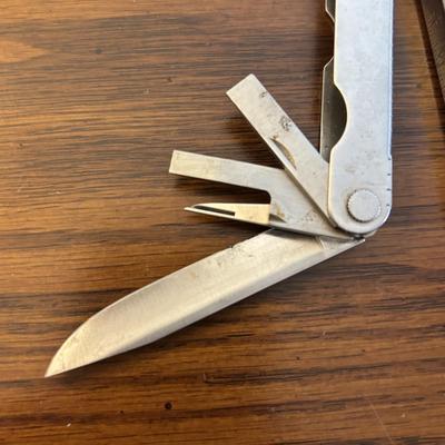 LOT 94: Pocket Knives: Brown Stone 715, Leatherman Tool, Combo Edge