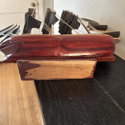 LOT 500: Home Decor Collection: Fish Wall Art, Wooden Model Pirate Ship, White Storage Cabinet, Framed Wall Art, Metal Pillar Candle Holders