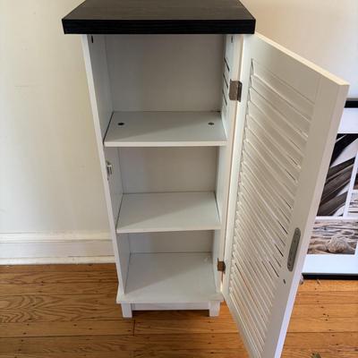 LOT 500: Home Decor Collection: Fish Wall Art, Wooden Model Pirate Ship, White Storage Cabinet, Framed Wall Art, Metal Pillar Candle Holders