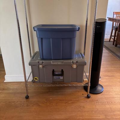LOT 101: Metal Garment Rack on Wheels, Rubber Maid Storage Tote, Sterilite Footlocker on Wheels & Intertek Tower Fan