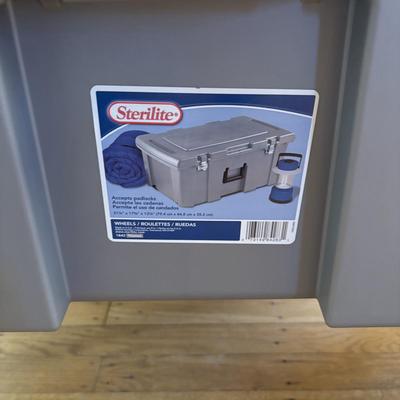 LOT 101: Metal Garment Rack on Wheels, Rubber Maid Storage Tote, Sterilite Footlocker on Wheels & Intertek Tower Fan