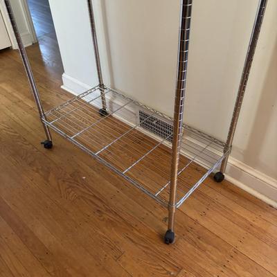 LOT 101: Metal Garment Rack on Wheels, Rubber Maid Storage Tote, Sterilite Footlocker on Wheels & Intertek Tower Fan