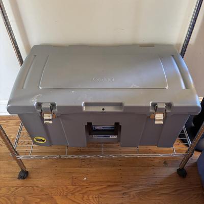 LOT 101: Metal Garment Rack on Wheels, Rubber Maid Storage Tote, Sterilite Footlocker on Wheels & Intertek Tower Fan