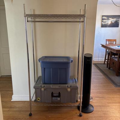 LOT 101: Metal Garment Rack on Wheels, Rubber Maid Storage Tote, Sterilite Footlocker on Wheels & Intertek Tower Fan
