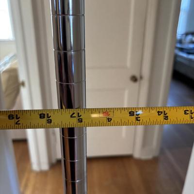 LOT 101: Metal Garment Rack on Wheels, Rubber Maid Storage Tote, Sterilite Footlocker on Wheels & Intertek Tower Fan