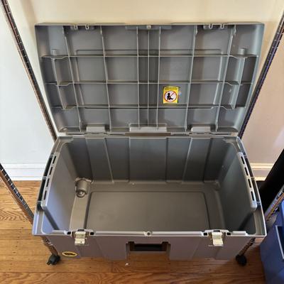 LOT 101: Metal Garment Rack on Wheels, Rubber Maid Storage Tote, Sterilite Footlocker on Wheels & Intertek Tower Fan