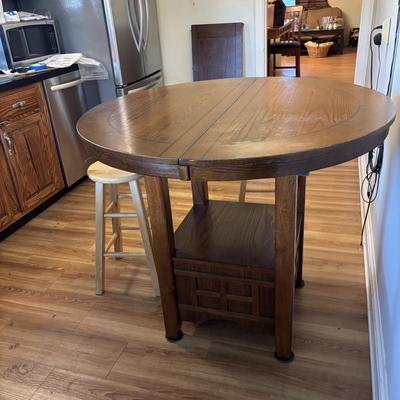 LOT 106: Round Pub Style table w/2 Wooden Stools