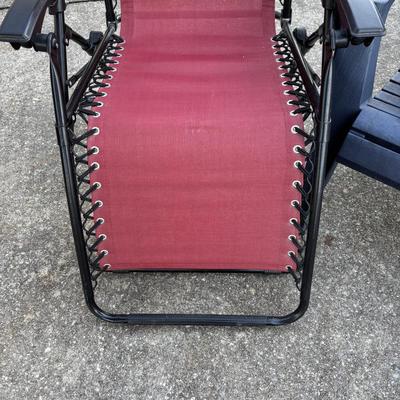 LOT 107: Outdoor Zero Gravity Chair along with an Adirondack Plastic Love Seat (appears to be painted)