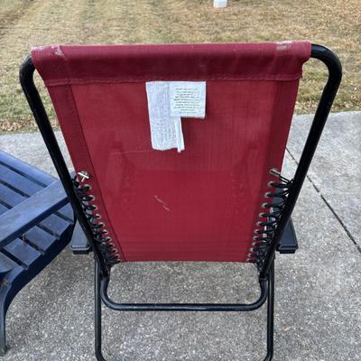 LOT 107: Outdoor Zero Gravity Chair along with an Adirondack Plastic Love Seat (appears to be painted)