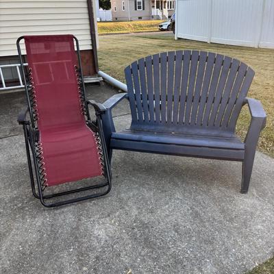 LOT 107: Outdoor Zero Gravity Chair along with an Adirondack Plastic Love Seat (appears to be painted)