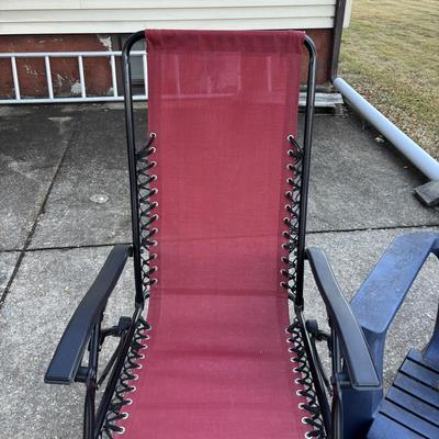 LOT 107: Outdoor Zero Gravity Chair along with an Adirondack Plastic Love Seat (appears to be painted)