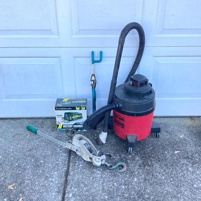 LOT 118: Shop Vac Wet / Dry 5 Gallon Vac, Schumacher Battery Charger in Original Box, Lug-All Hoist and The Club Steering Wheel Lock with...