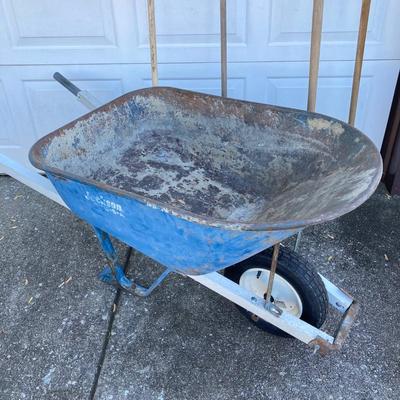 LOT 120: Jackson Metal Wheel Barrow with Rakes and Shovel