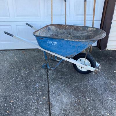 LOT 120: Jackson Metal Wheel Barrow with Rakes and Shovel