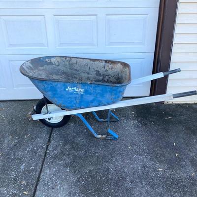 LOT 120: Jackson Metal Wheel Barrow with Rakes and Shovel
