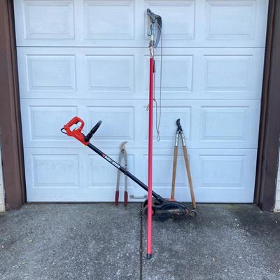 LOT 124: Black & Decker Edger LE750 with Extended Pole Saw and Fiskars