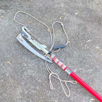 LOT 124: Black & Decker Edger LE750 with Extended Pole Saw and Fiskars