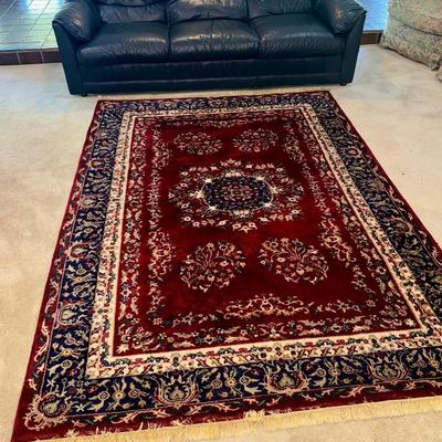 Midnight, blue leather sofa, and rug