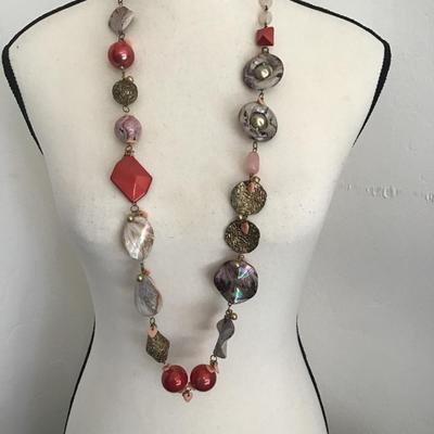 Sale Photo Thumbnail #185: Very nice long beaded statement necklace with a mix of red pink and gray beads and various pendants. Please see attached photos.