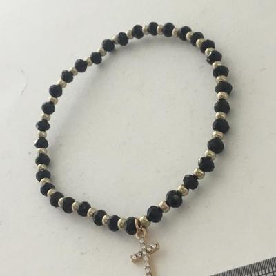 Gold tone cross stretchy bracelet