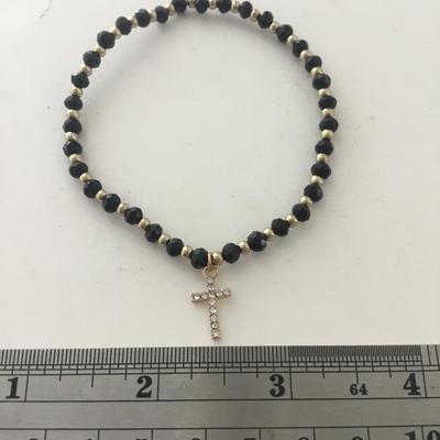 Gold tone cross stretchy bracelet