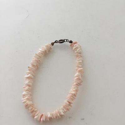 Light pink shell type bracelet with matching earrings