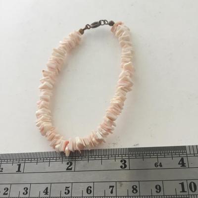 Light pink shell type bracelet with matching earrings