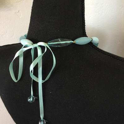 Cute light baby blue long tube, faceted bead, necklace, silver silver ribbon tie