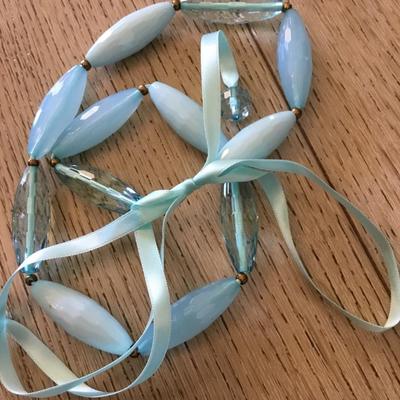 Cute light baby blue long tube, faceted bead, necklace, silver silver ribbon tie