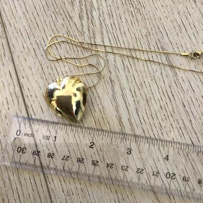 Vintage puffed heart pendant combination lock it in music box. Excellent condition works perfectly.