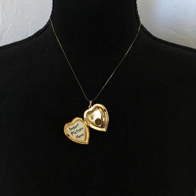 Vintage puffed heart pendant combination lock it in music box. Excellent condition works perfectly.