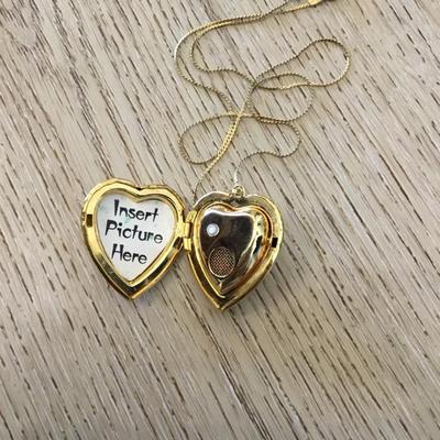 Vintage puffed heart pendant combination lock it in music box. Excellent condition works perfectly.