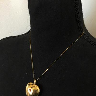 Vintage puffed heart pendant combination lock it in music box. Excellent condition works perfectly.