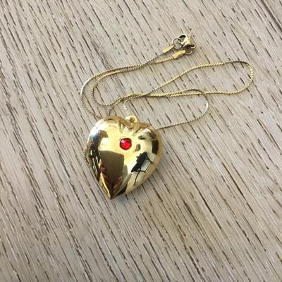 Vintage puffed heart pendant combination lock it in music box. Excellent condition works perfectly.