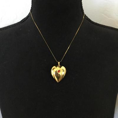Vintage puffed heart pendant combination lock it in music box. Excellent condition works perfectly.