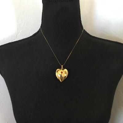 Vintage puffed heart pendant combination lock it in music box. Excellent condition works perfectly.