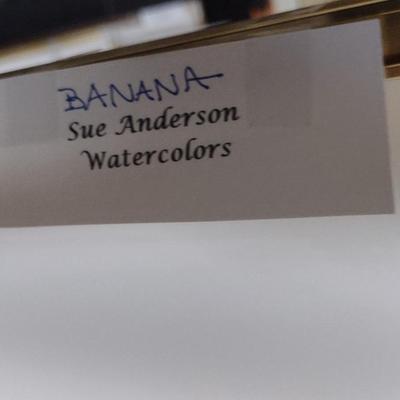 Sale Photo Thumbnail #1316: 'Banana' Original Framed Watercolor by Nationally Recognized Artist Susan Anderson (#10).  Item is framed under plexiglass.