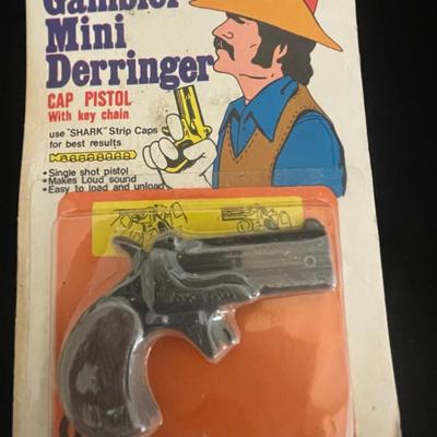 UNOPENED MINI DERRINGER AND SMALL RIFLE