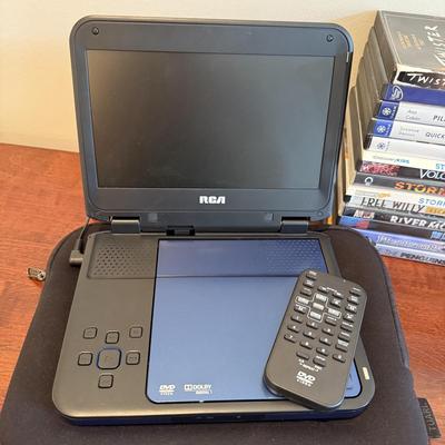 LOT 258: RCA Portable DVD Player w/ Misc DVDs