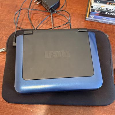 LOT 258: RCA Portable DVD Player w/ Misc DVDs