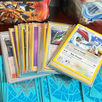 LOT 259D: Sleeved Pokémon Deck, Empty Collectors Tins & More